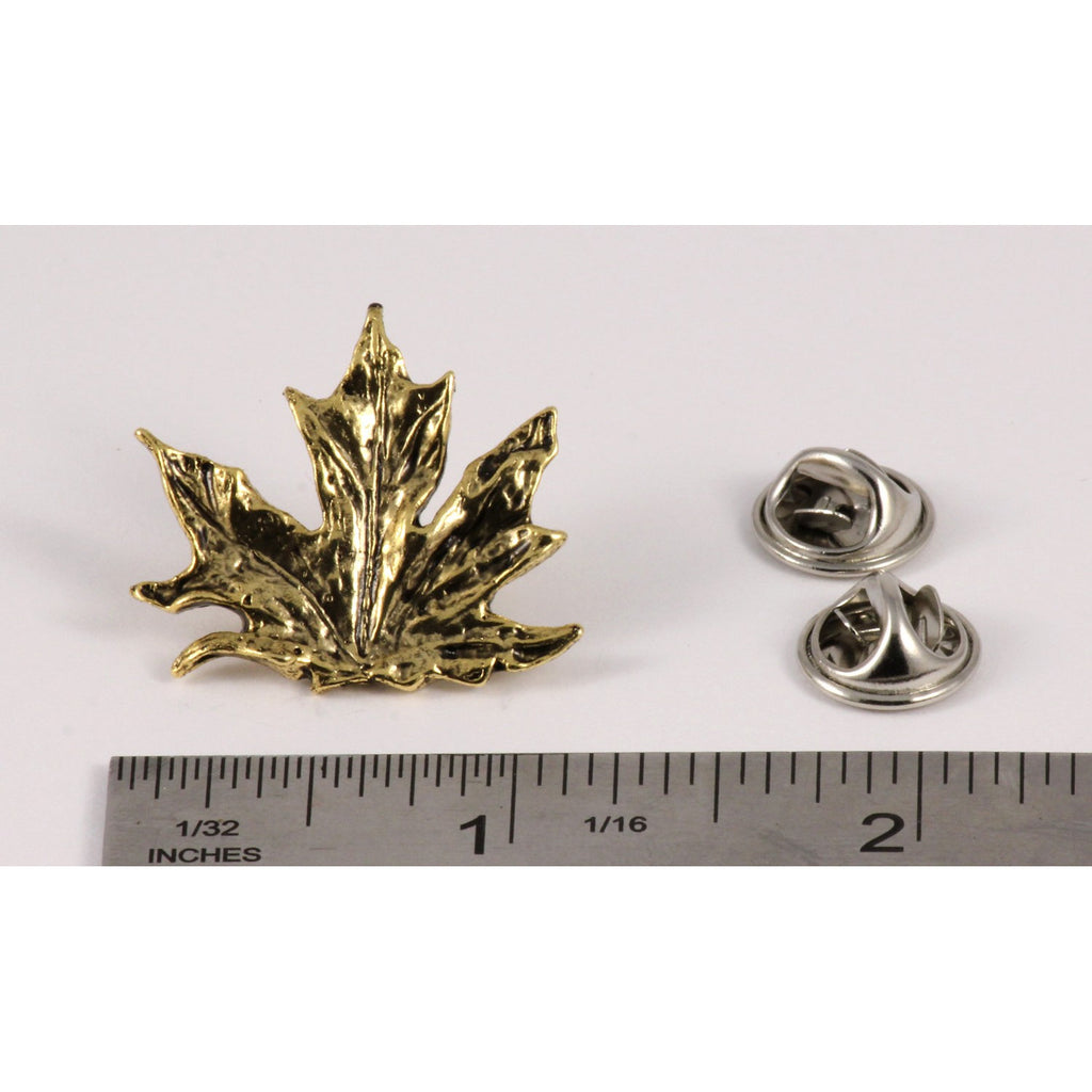A handcrafted Maple Leaf Pin next to a ruler, available for sale at Creativeartisan.com - the image offers a sense of scale
