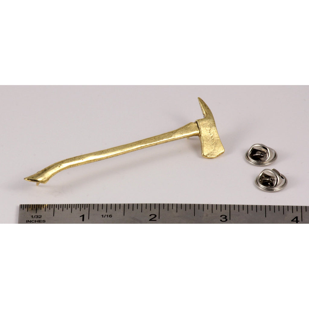 A handcrafted Firemans Axe Pin next to a ruler, available for sale at Creativeartisan.com - the image offers a sense of scale