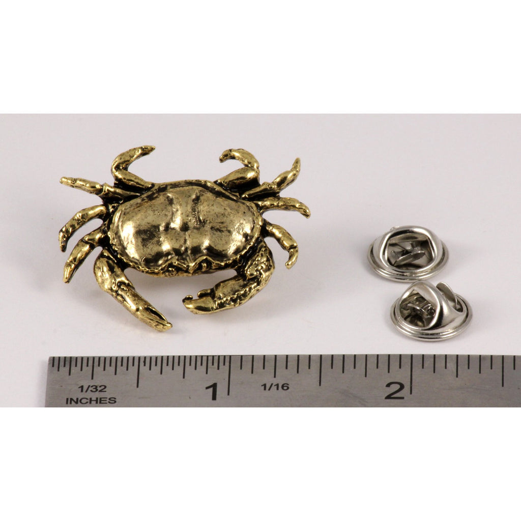 A handcrafted Dungeness Crab Pin next to a ruler, available for sale at Creativeartisan.com - the image offers a sense of scale
