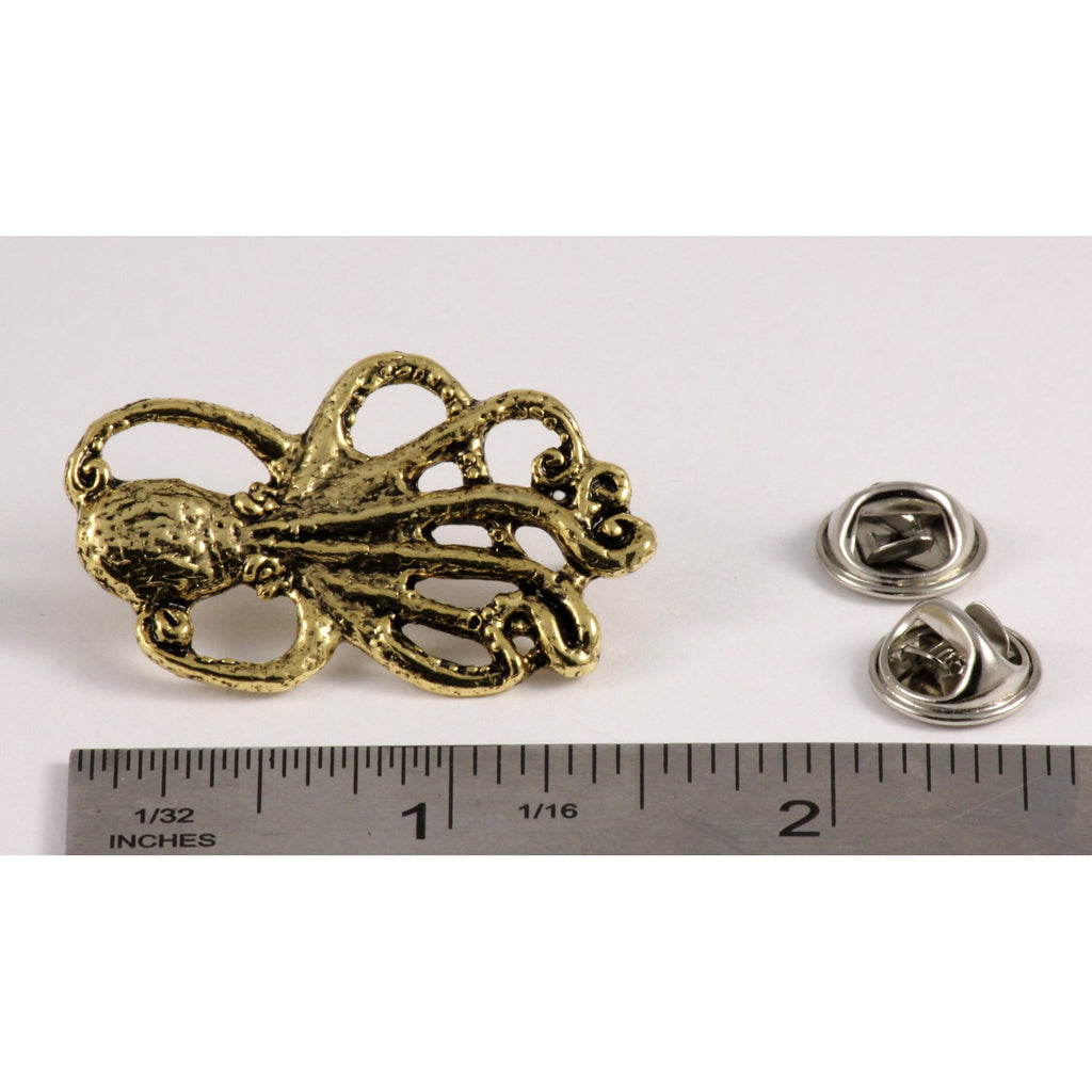 A handcrafted Octopus Pin next to a ruler, available for sale at Creativeartisan.com - the image offers a sense of scale