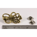 A handcrafted Octopus Pin next to a ruler, available for sale at Creativeartisan.com - the image offers a sense of scale