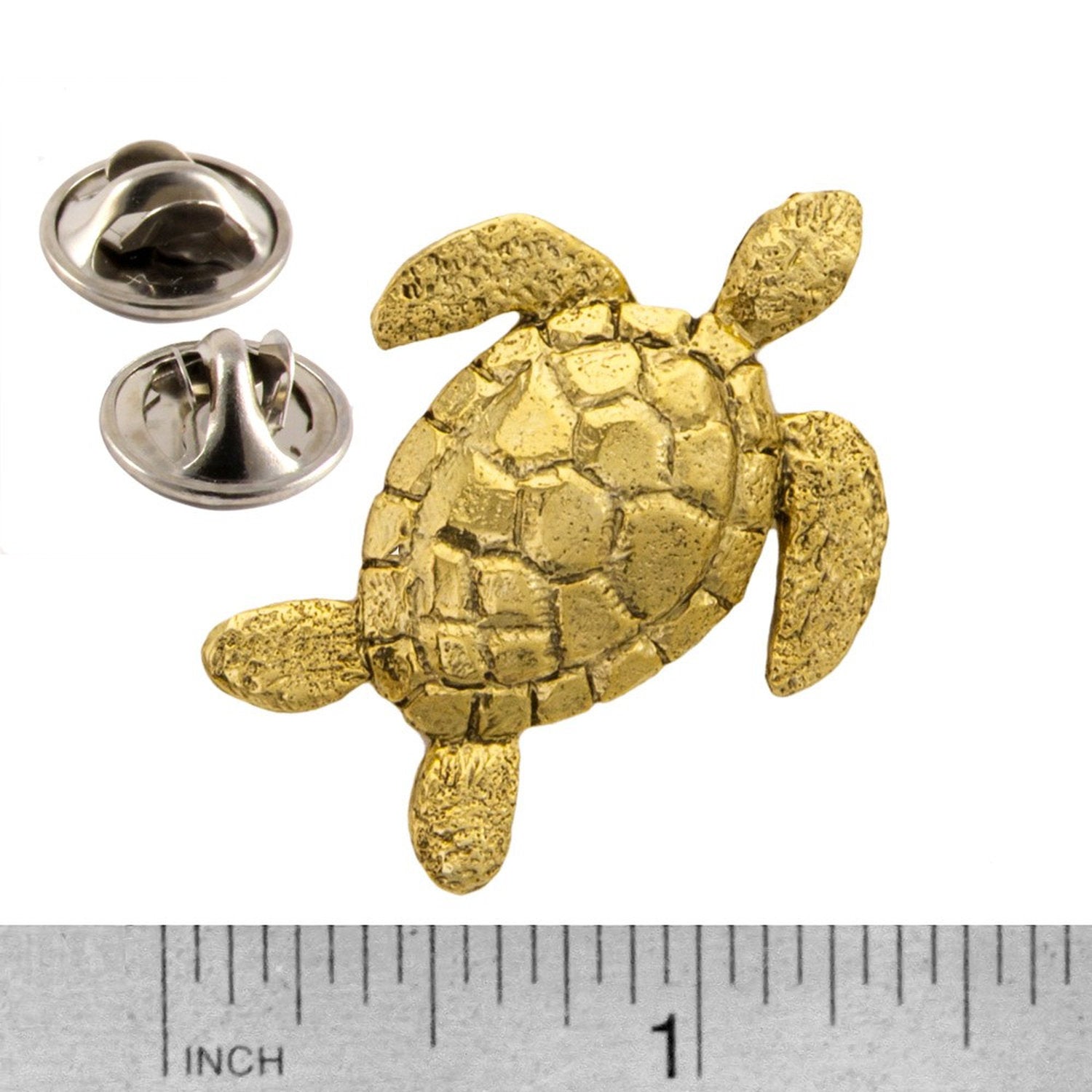 A handcrafted Sea Turtle Top View Pin next to a ruler, available for sale at Creativeartisan.com - the image offers a sense of scale