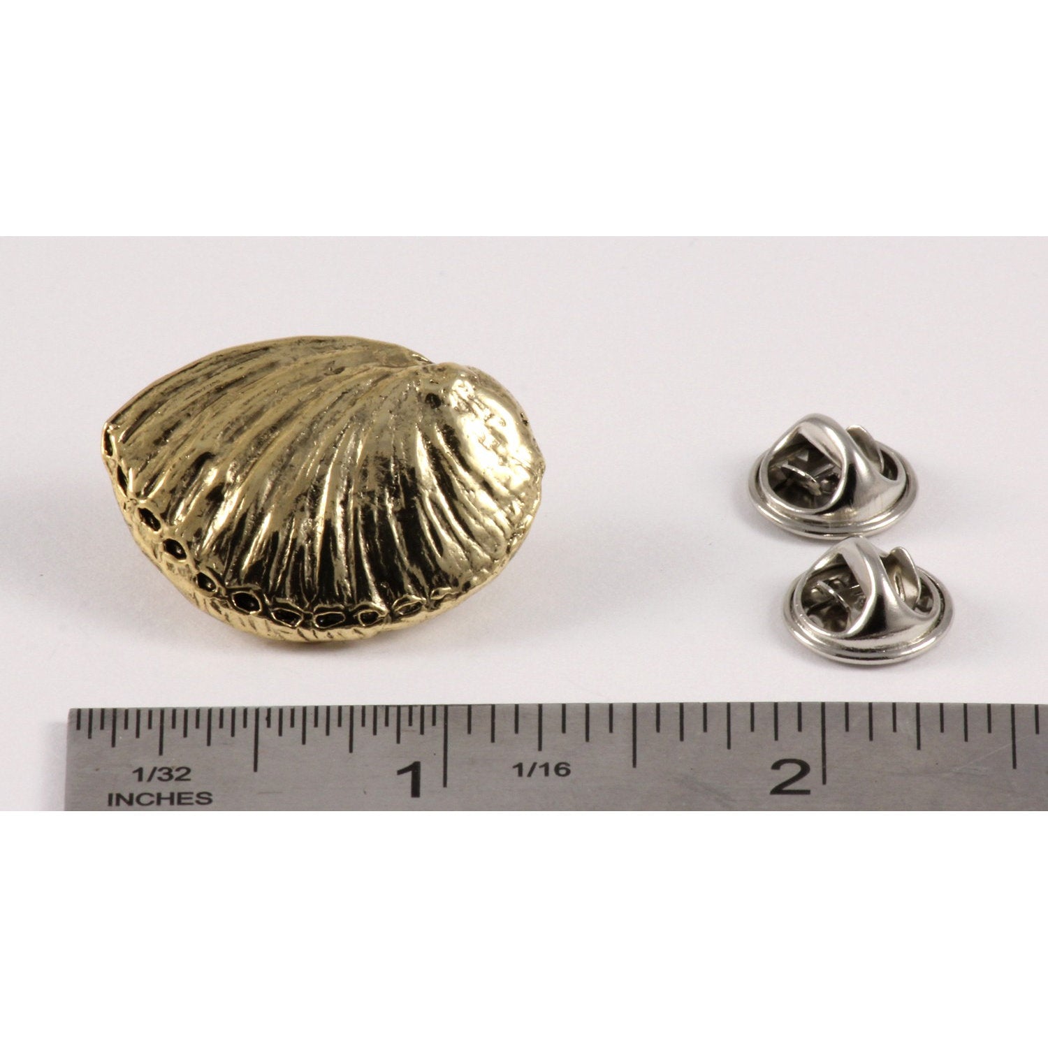 A handcrafted Abalone Shell Pin next to a ruler, available for sale at Creativeartisan.com - the image offers a sense of scale