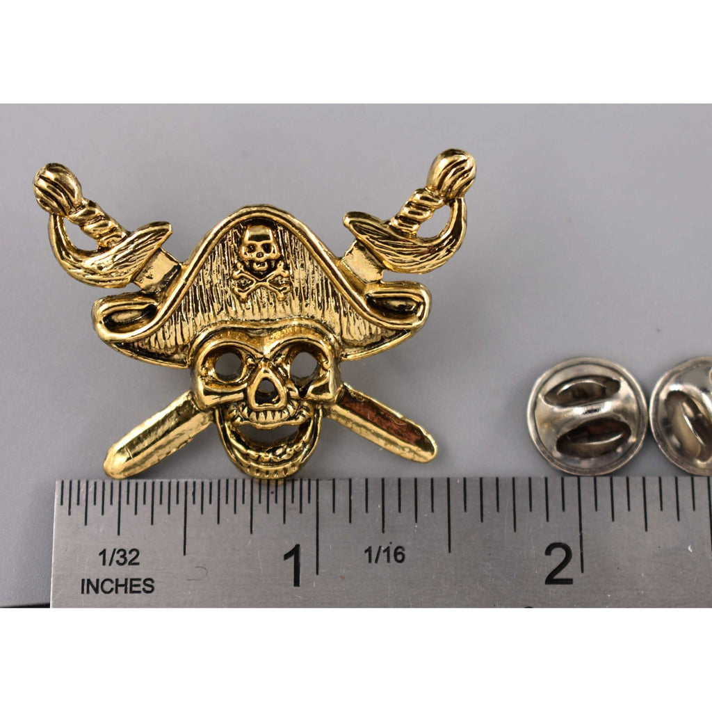 A handcrafted Pirate Head Pin next to a ruler, available for sale at Creativeartisan.com - the image offers a sense of scale