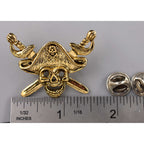 A handcrafted Pirate Head Pin next to a ruler, available for sale at Creativeartisan.com - the image offers a sense of scale