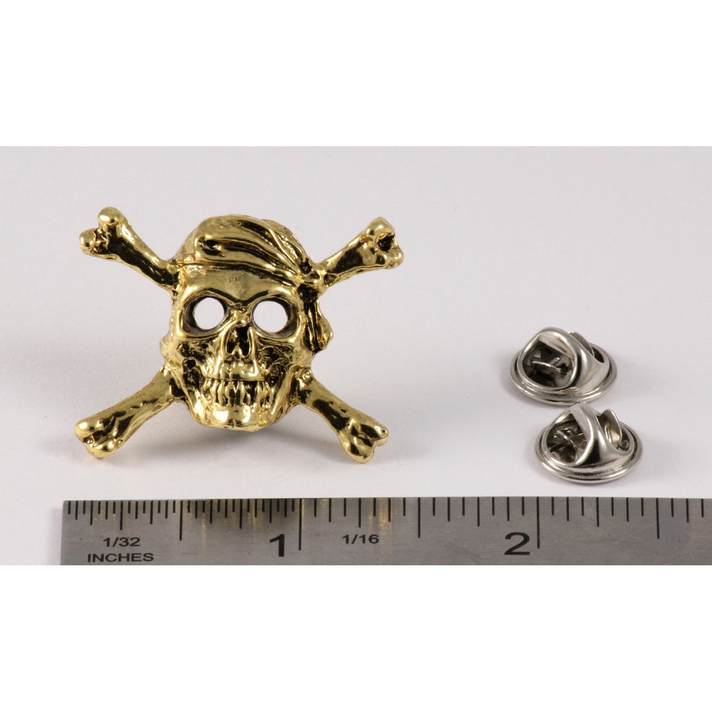 A handcrafted Pirate Skull Crossbones Pin next to a ruler, available for sale at Creativeartisan.com - the image offers a sense of scale