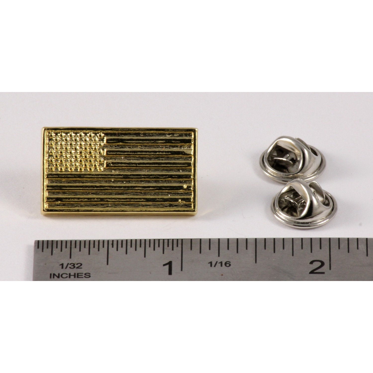 A handcrafted American Flag Profile Pin next to a ruler, available for sale at Creativeartisan.com - the image offers a sense of scale