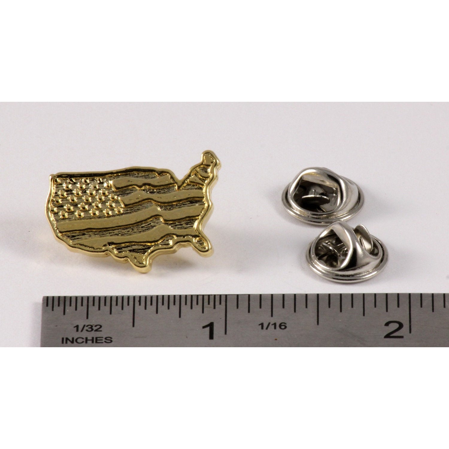 A handcrafted American Flag Pin next to a ruler, available for sale at Creativeartisan.com - the image offers a sense of scale