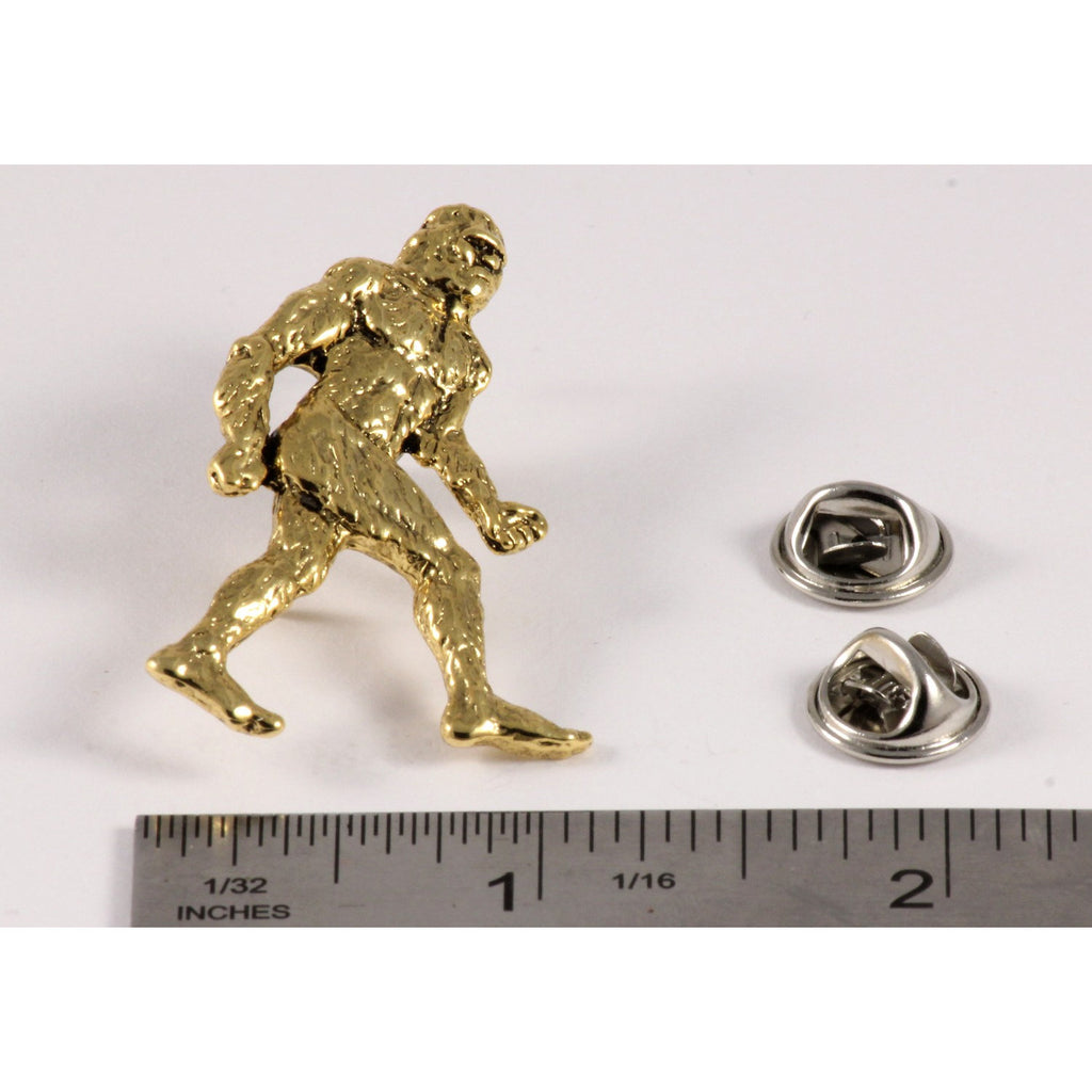 A handcrafted Sasquatch Bigfoot Full Body Pin next to a ruler, available for sale at Creativeartisan.com - the image offers a sense of scale