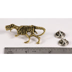 A handcrafted Tyrannosaurus Rex Fossilized Body Pin next to a ruler, available for sale at Creativeartisan.com - the image offers a sense of scale