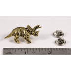 A handcrafted Triceratops Pin next to a ruler, available for sale at Creativeartisan.com - the image offers a sense of scale