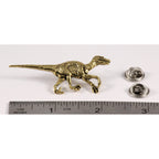 A handcrafted Velociraptor Pin next to a ruler, available for sale at Creativeartisan.com - the image offers a sense of scale