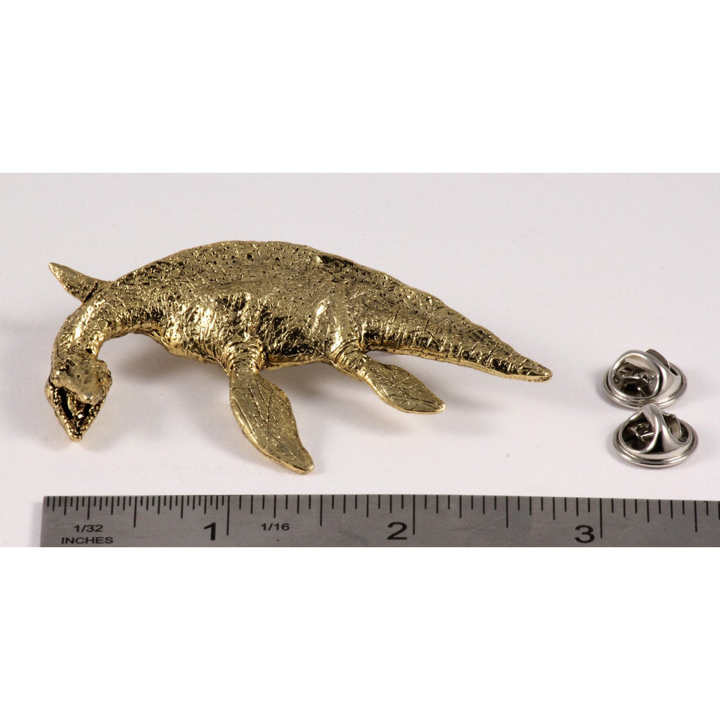 A handcrafted Elasmosaurus Prehistoric Marine Reptile Pin next to a ruler, available for sale at Creativeartisan.com - the image offers a sense of scale