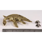 A handcrafted Elasmosaurus Prehistoric Marine Reptile Pin next to a ruler, available for sale at Creativeartisan.com - the image offers a sense of scale