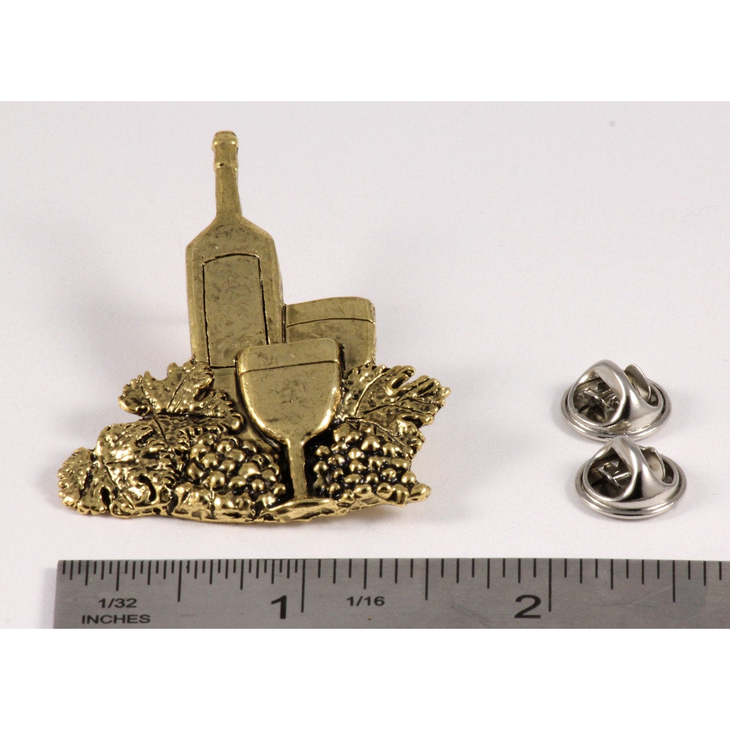 A handcrafted White Wine Bottle Glass Pin next to a ruler, available for sale at Creativeartisan.com - the image offers a sense of scale
