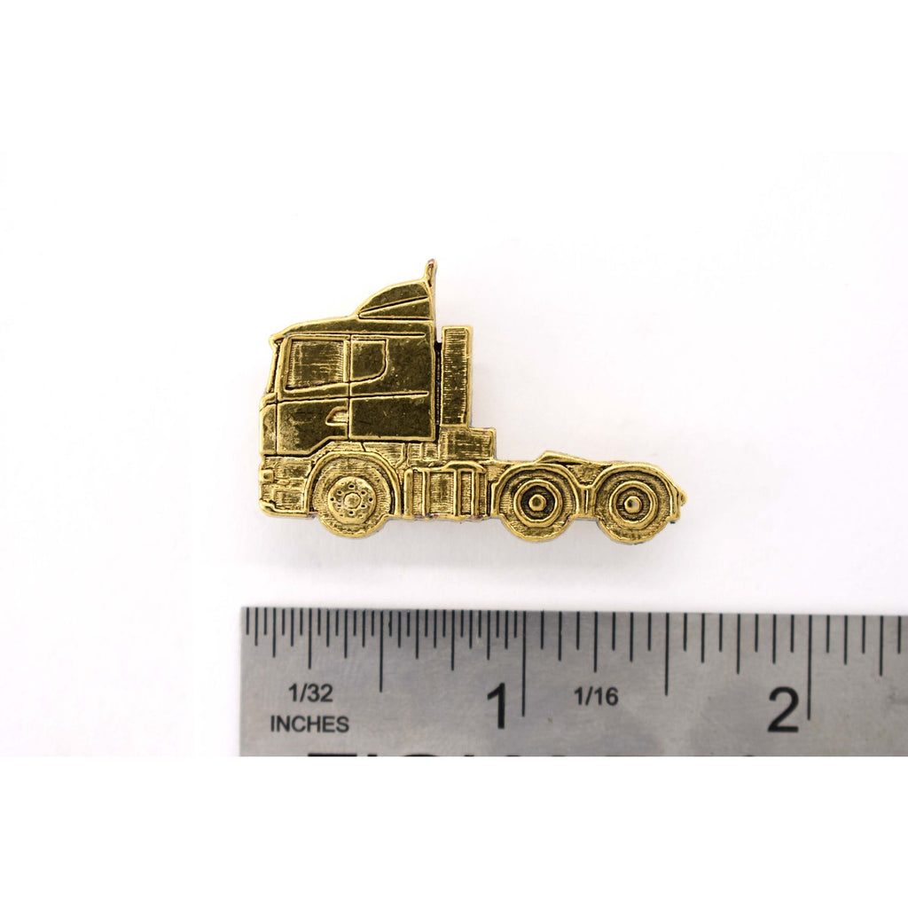 A handcrafted Semi Truck Short Nose Pin next to a ruler, available for sale at Creativeartisan.com - the image offers a sense of scale