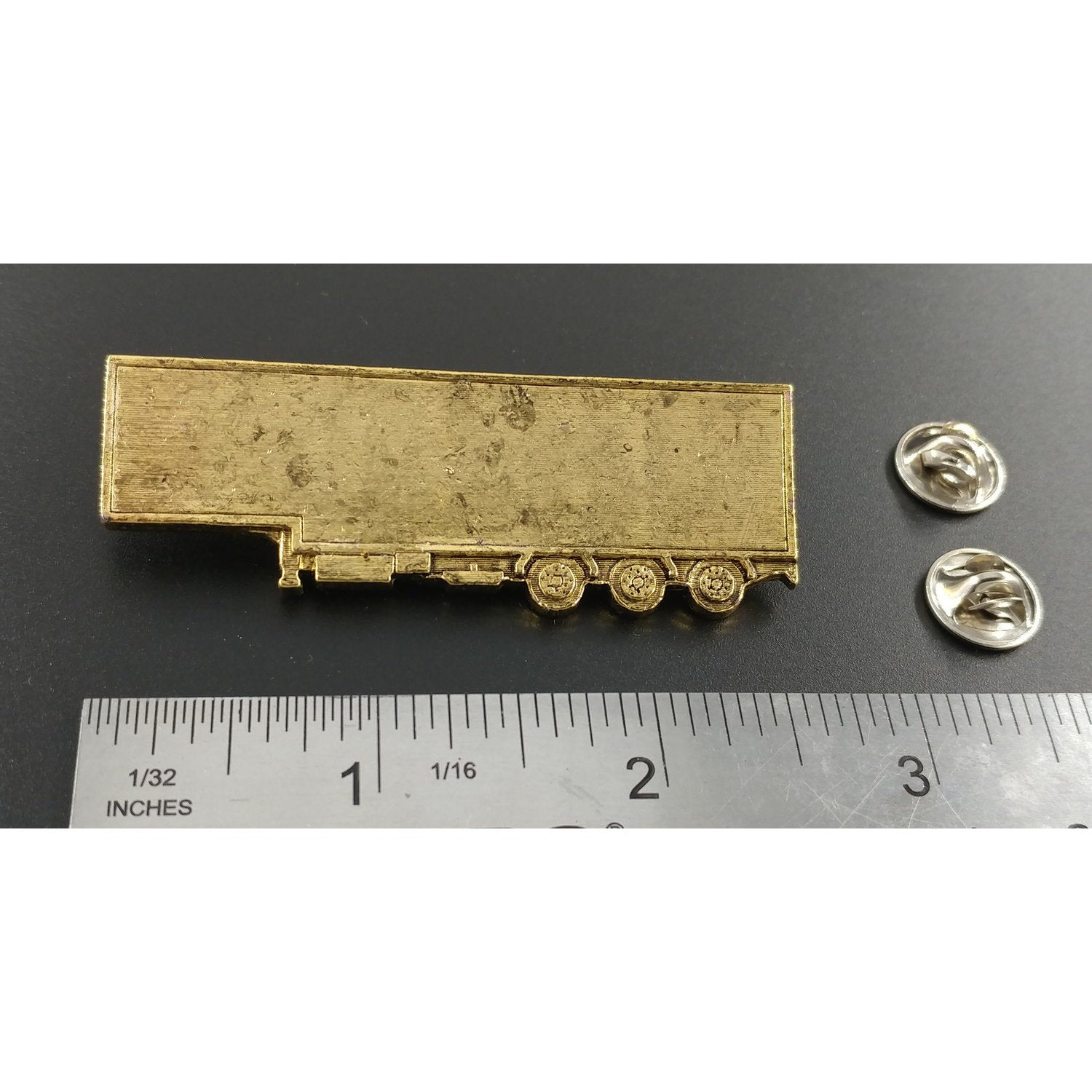 A handcrafted Semi Truck Trailer Pin next to a ruler, available for sale at Creativeartisan.com - the image offers a sense of scale