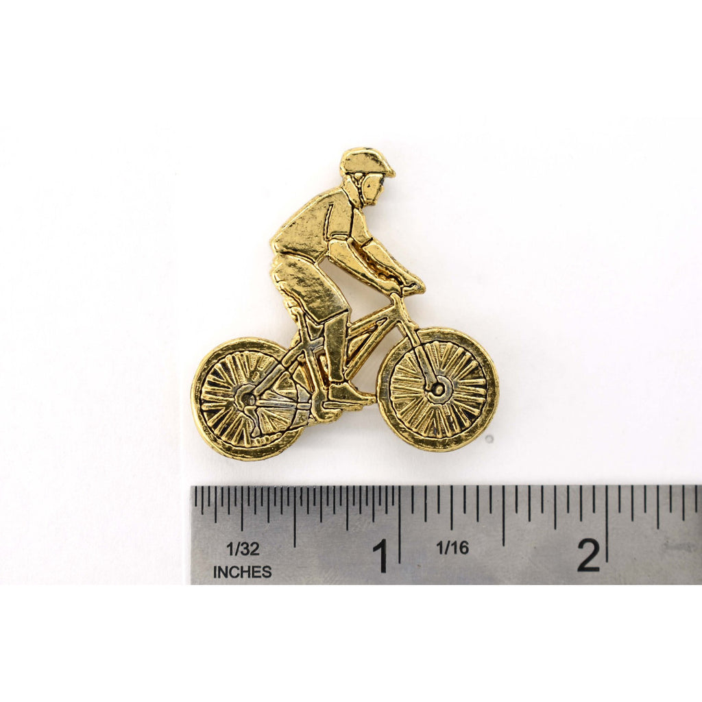 A handcrafted Bicycler Pin next to a ruler, available for sale at Creativeartisan.com - the image offers a sense of scale