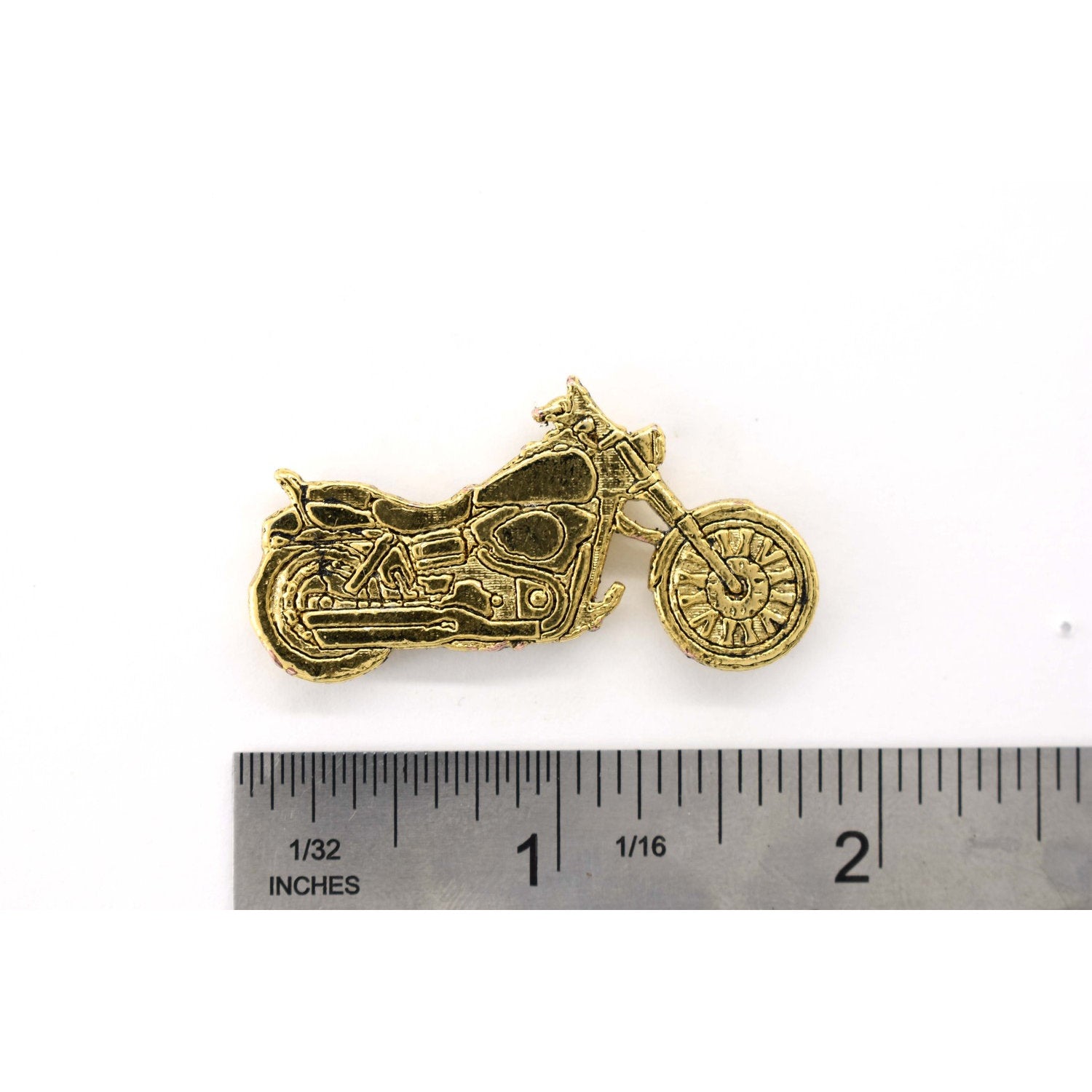 A handcrafted Motorcycle Pin next to a ruler, available for sale at Creativeartisan.com - the image offers a sense of scale