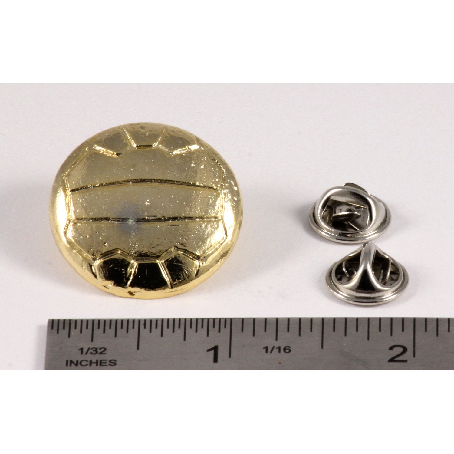 A handcrafted Soccer Ball W Lines Pin next to a ruler, available for sale at Creativeartisan.com - the image offers a sense of scale