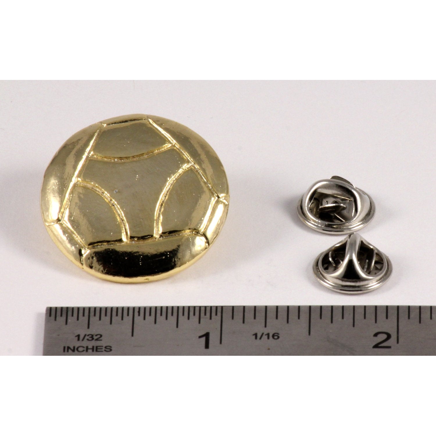 A handcrafted Soccer Ball W Y Pin next to a ruler, available for sale at Creativeartisan.com - the image offers a sense of scale