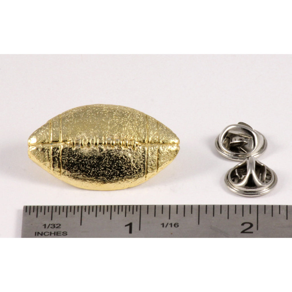 A handcrafted Football Pin next to a ruler, available for sale at Creativeartisan.com - the image offers a sense of scale