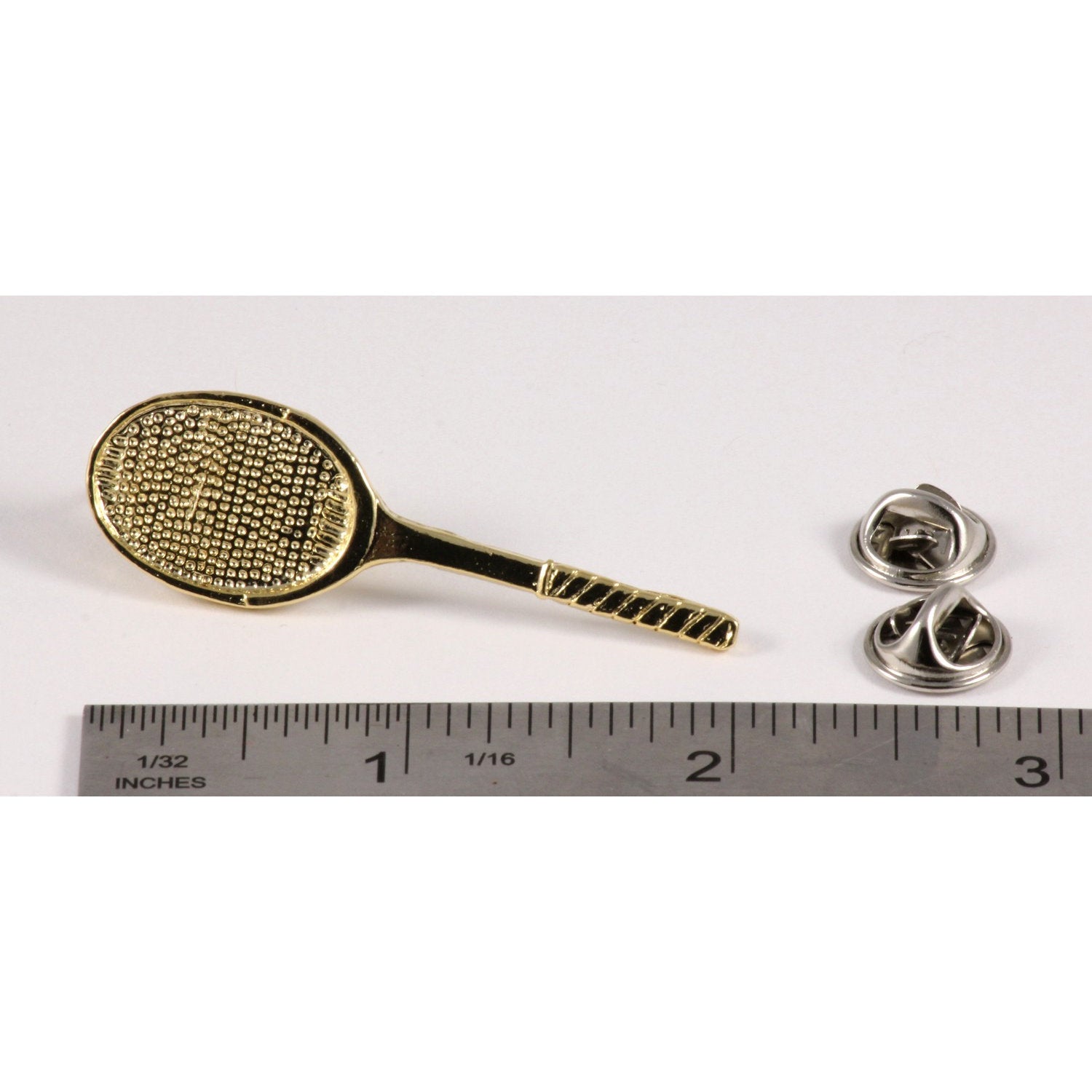 A handcrafted Tennis Racquet Pin next to a ruler, available for sale at Creativeartisan.com - the image offers a sense of scale