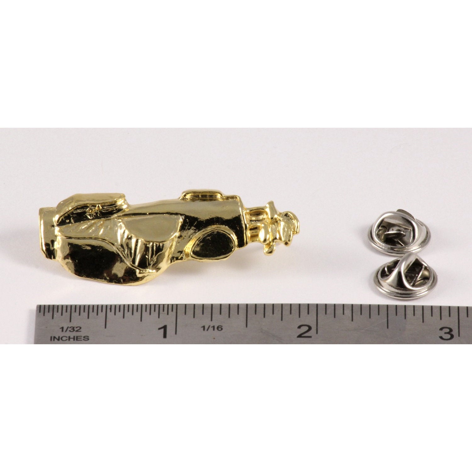 A handcrafted Golf Bag Pin next to a ruler, available for sale at Creativeartisan.com - the image offers a sense of scale