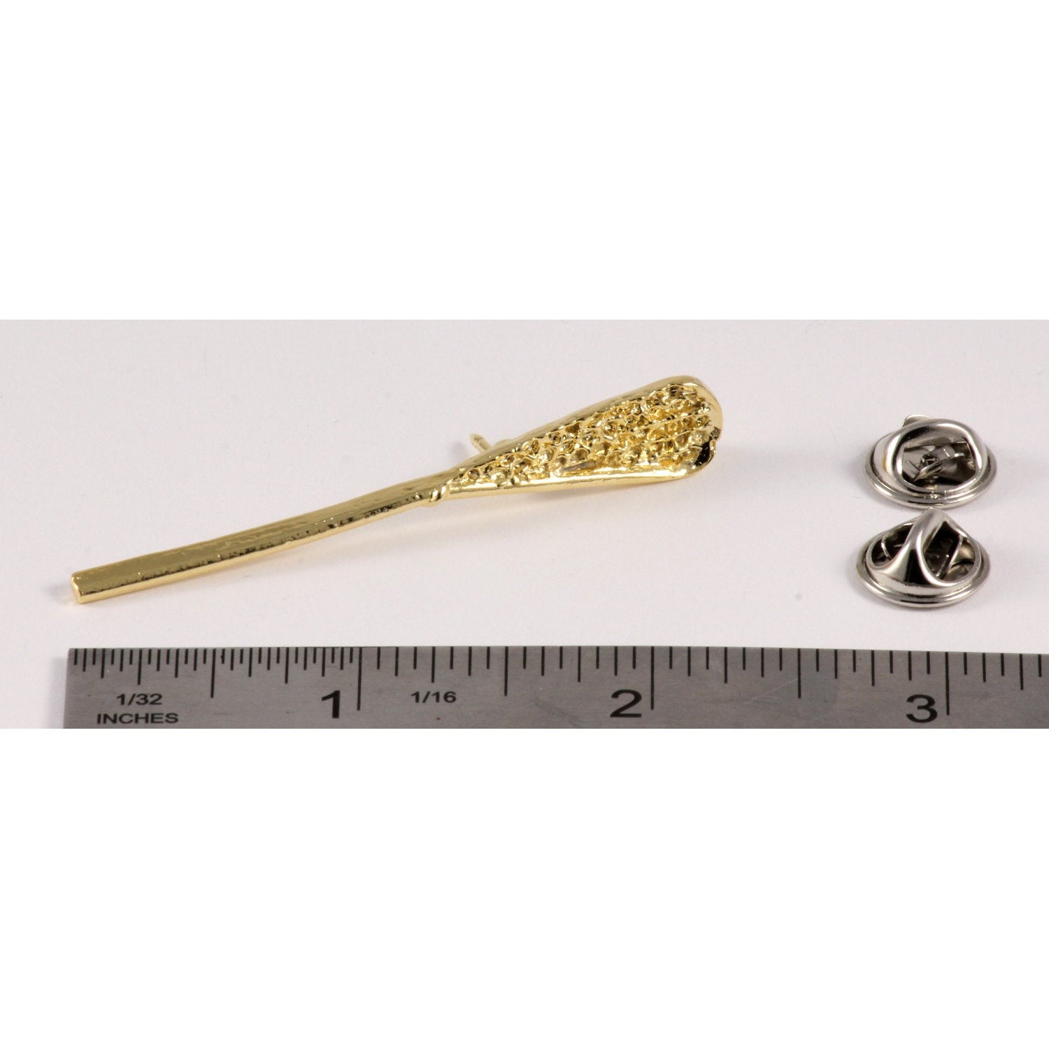 A handcrafted La Crosse Native Stick Pin next to a ruler, available for sale at Creativeartisan.com - the image offers a sense of scale