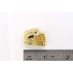 A handcrafted La Crosse Helmet Pin next to a ruler, available for sale at Creativeartisan.com - the image offers a sense of scale