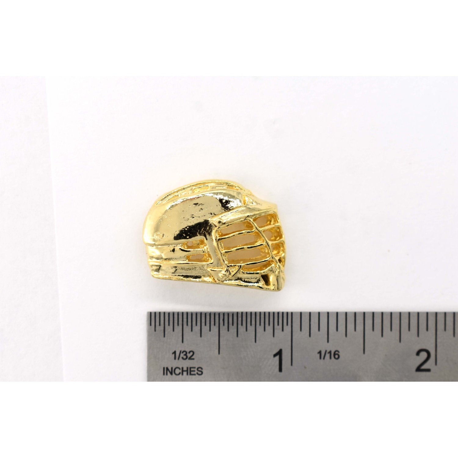 A handcrafted La Crosse Helmet Pin next to a ruler, available for sale at Creativeartisan.com - the image offers a sense of scale