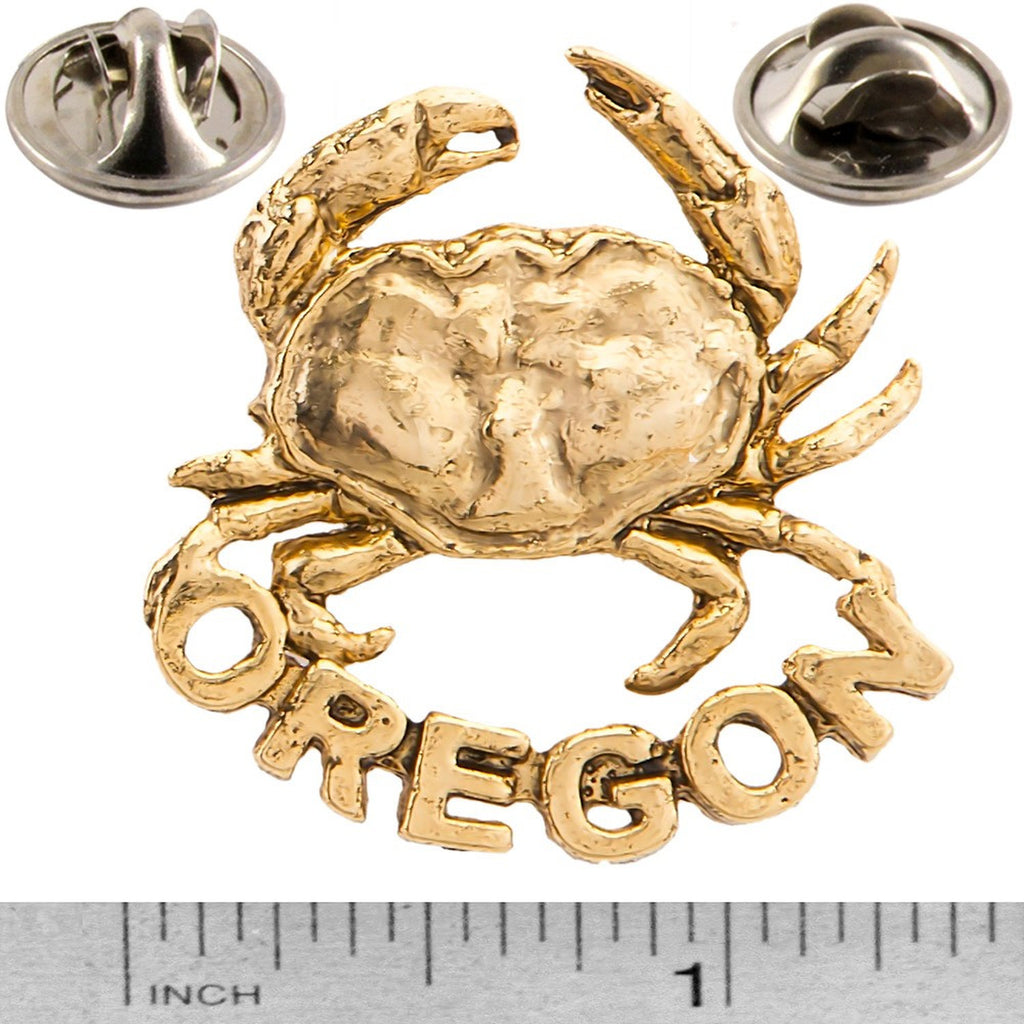 A handcrafted Dungeness Crab Oregon Pin next to a ruler, available for sale at Creativeartisan.com - the image offers a sense of scale