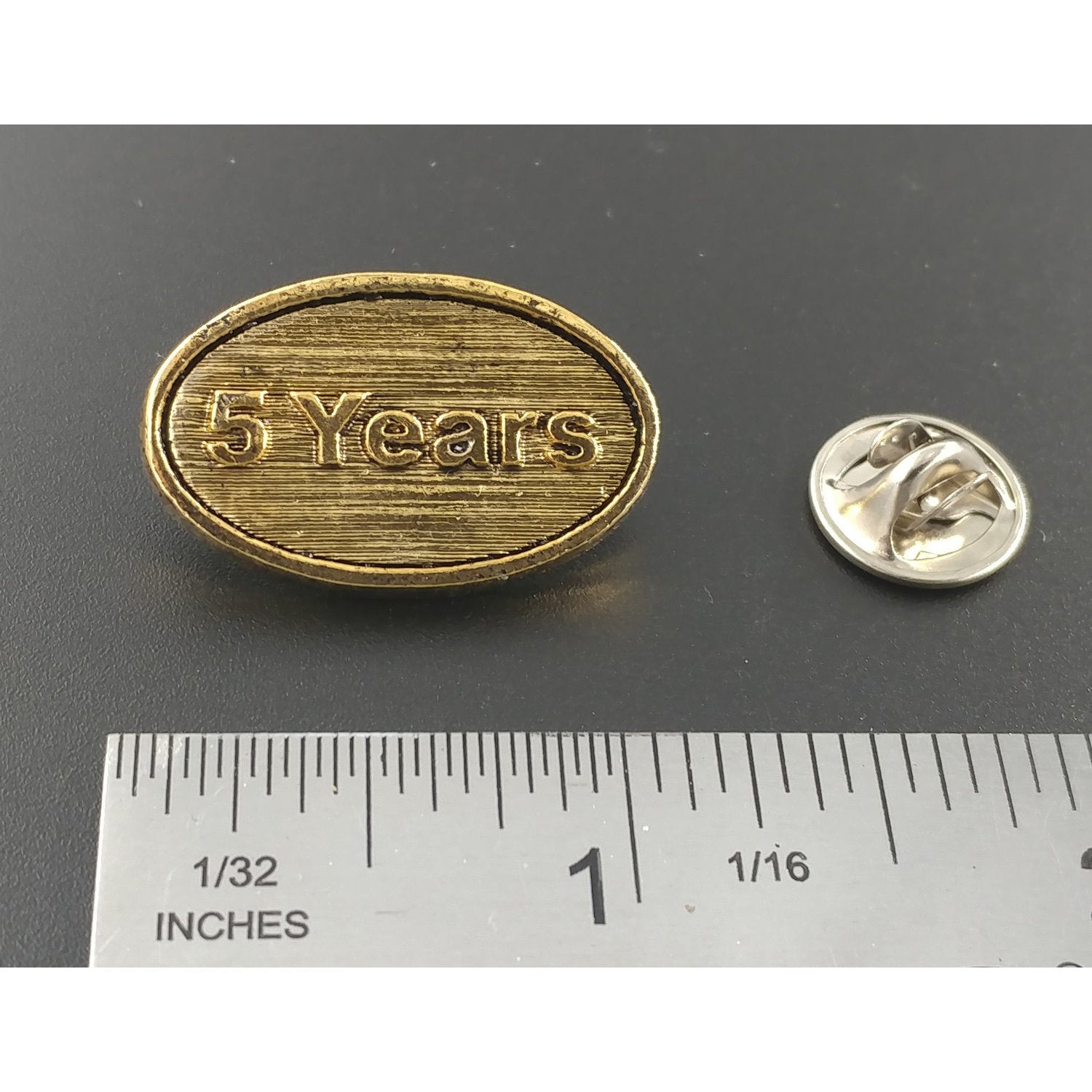 A handcrafted 5 Year Star Pin next to a ruler, available for sale at Creativeartisan.com - the image offers a sense of scale