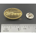 A handcrafted 10 Year Pin next to a ruler, available for sale at Creativeartisan.com - the image offers a sense of scale