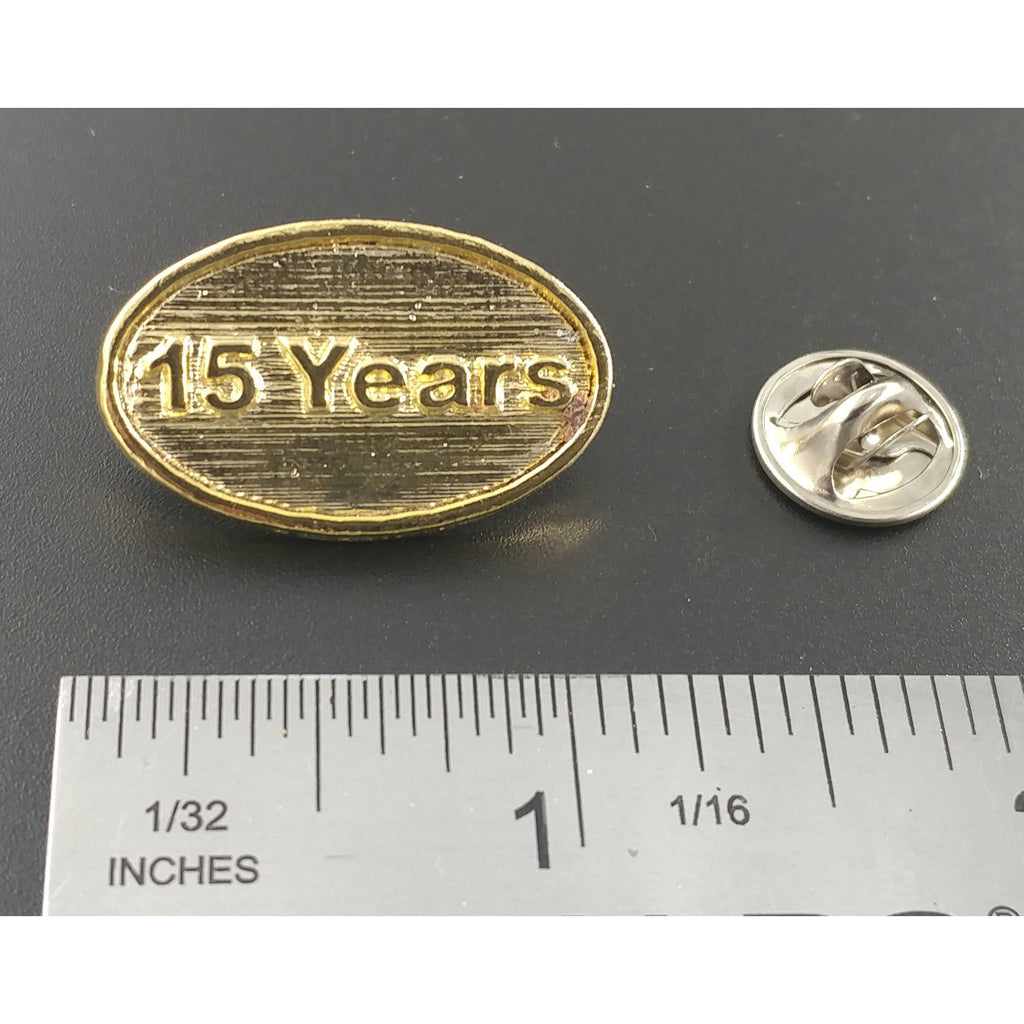 A handcrafted 15 Year Pin next to a ruler, available for sale at Creativeartisan.com - the image offers a sense of scale