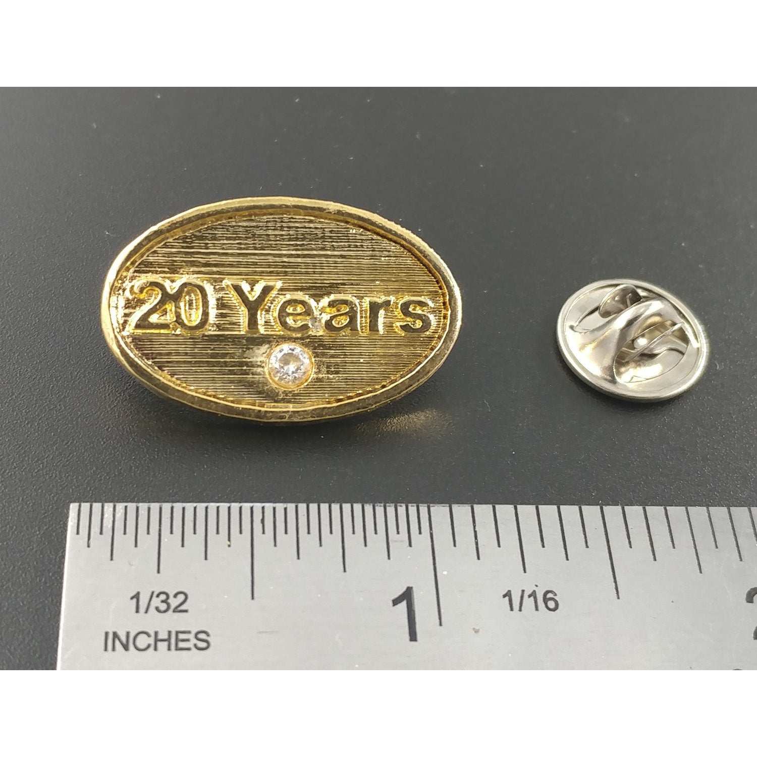 A handcrafted 20 Year Pin next to a ruler, available for sale at Creativeartisan.com - the image offers a sense of scale